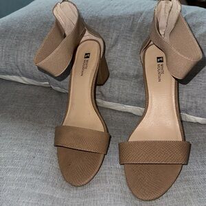 Tan strapping sandal with a 2 1/2 “ chunky heel